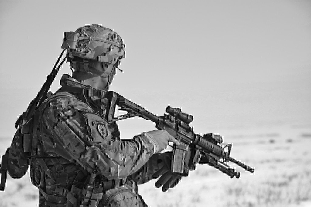 a military member with an m4