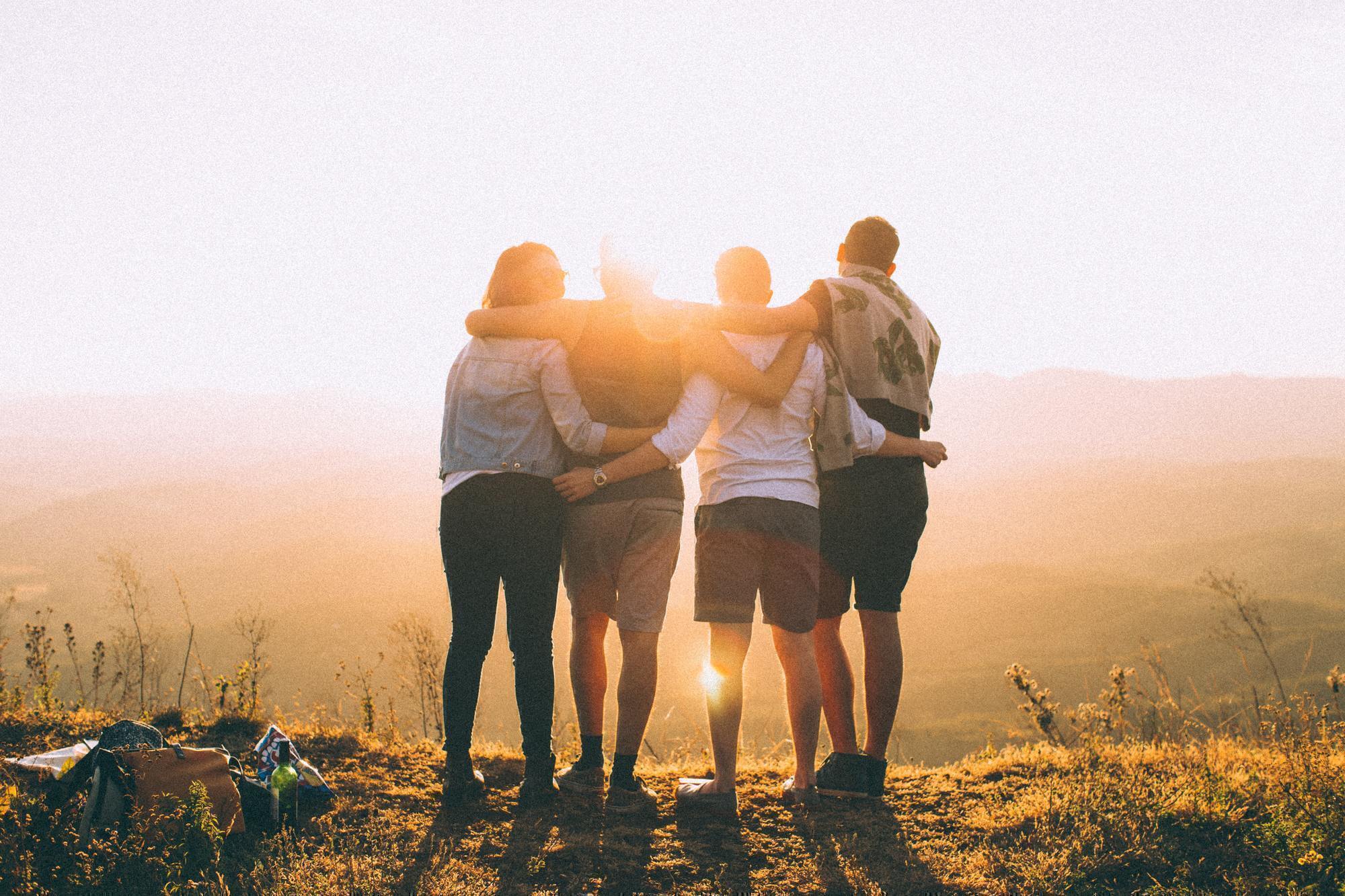 friends staring at the sunrise together