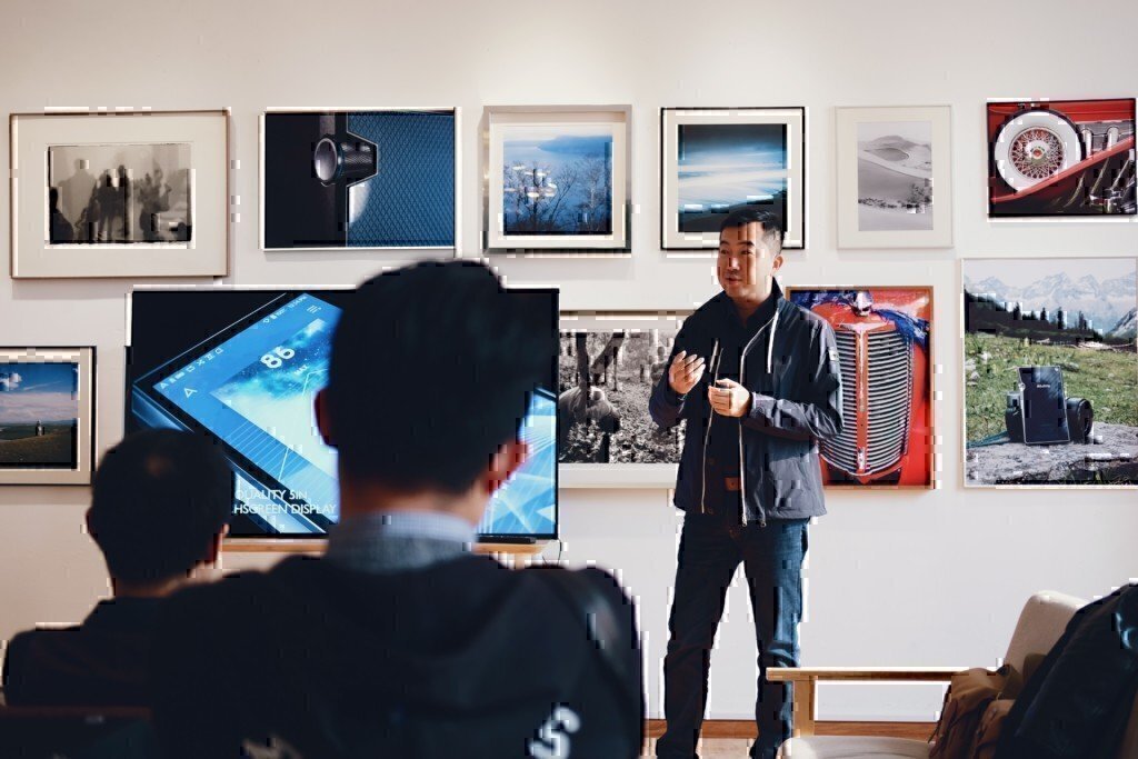 a man speaking to a class of people