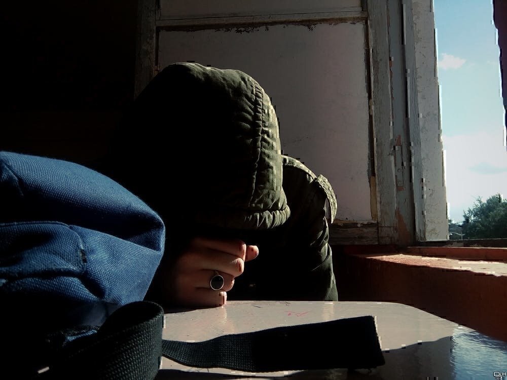 photo shows a person with their head down, possibly after making a mistake at a job interview