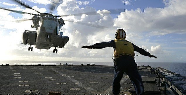 sailor-directing-helicopter-598790_640-e1454699629792