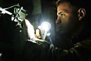 Photo shows a soldier working an IT Jobs