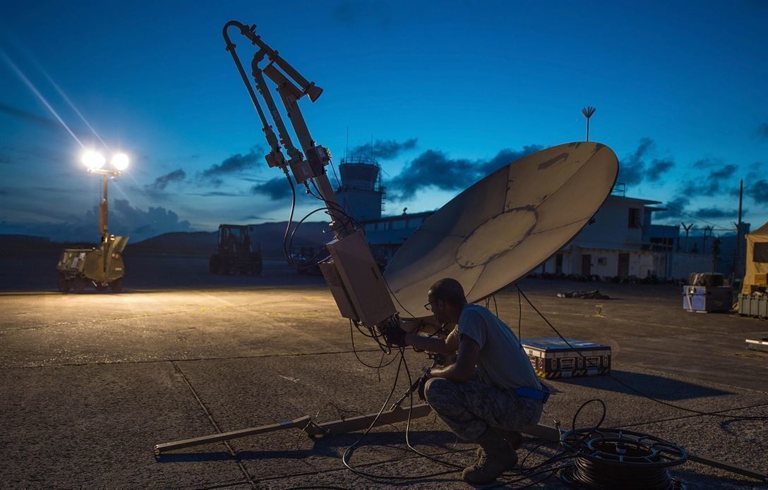 A Soldier checks a satellite. IT Jobs like this are common in the military