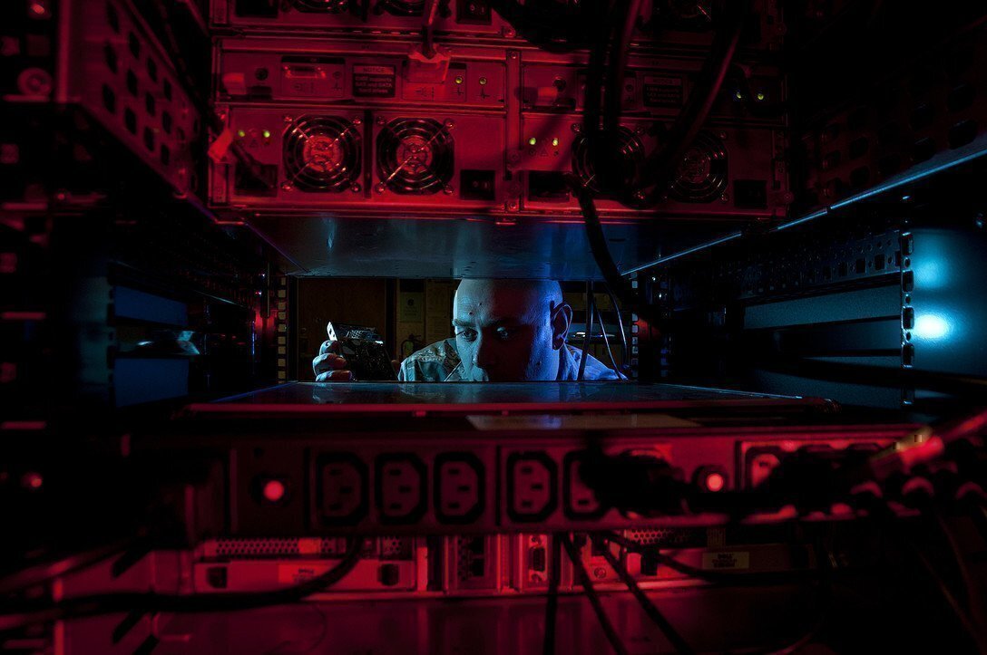 IT Jobs require you to be familiar with different systems and processes, like this Airman who is seen here installing a hard drive.