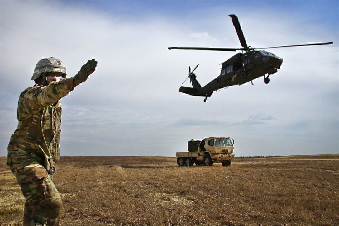 a soldier points a helicopter the right way