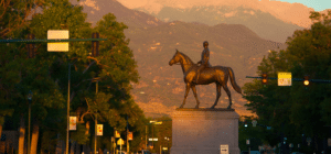 a statue in texas during a sunset