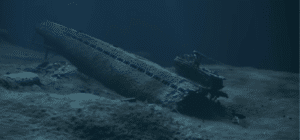 a wrecked submarine sits on the ocean floor