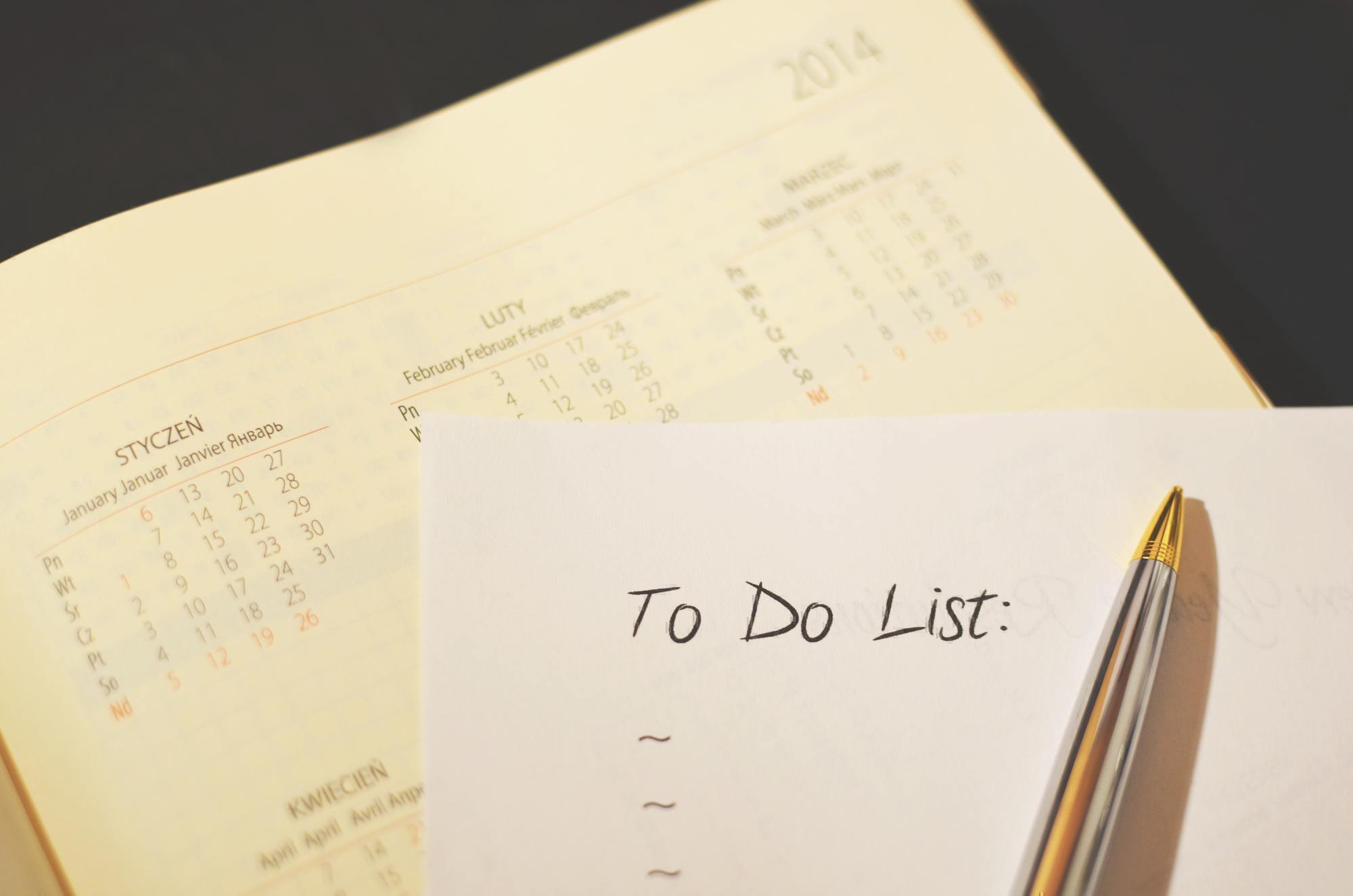 a to do list sits on top of a calendar