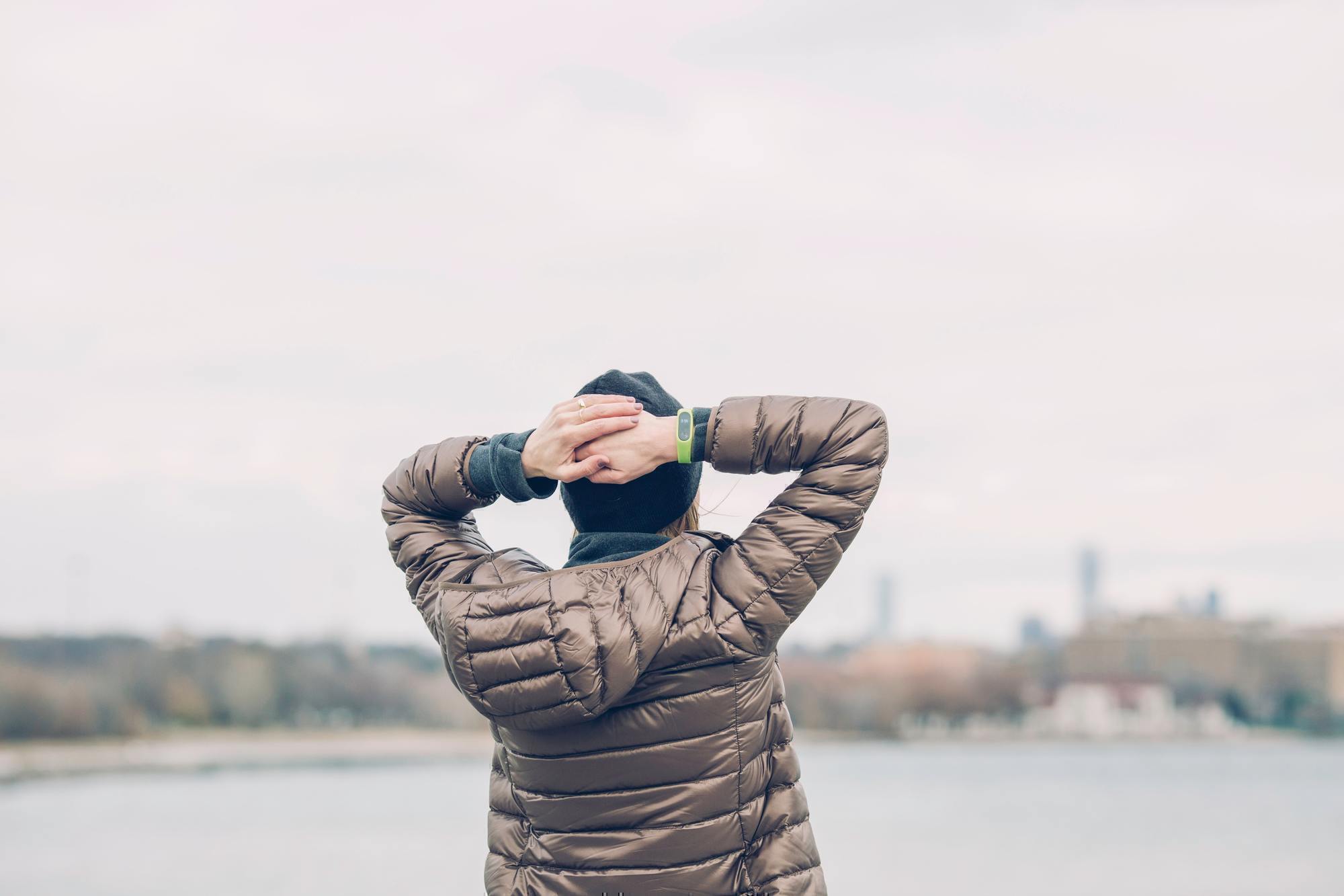 a man holds his hands over his head in thought