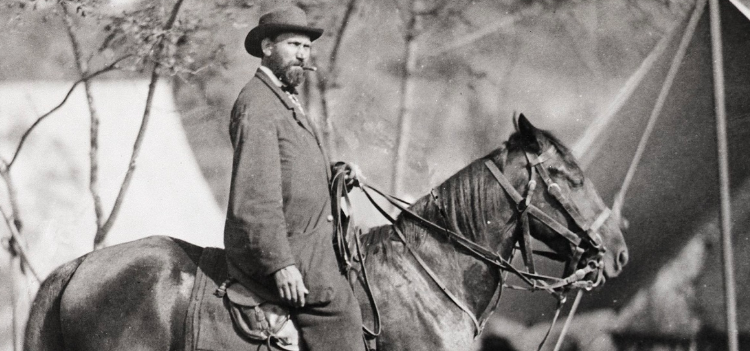 Alan Pinkerton sits on top of a horse
