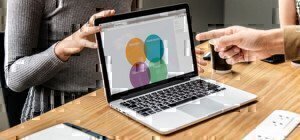 someone pointing to a screen with strengths and weaknesses in categories