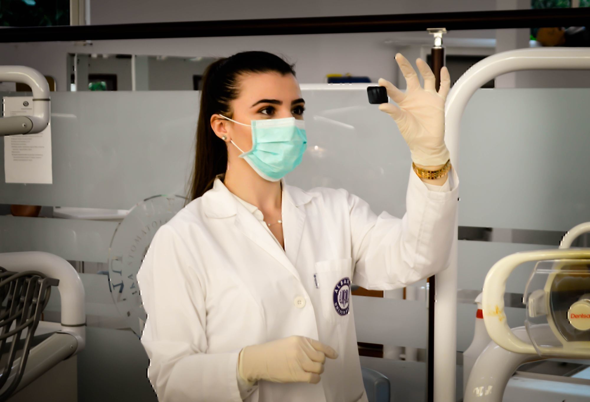 a lab technician looks at a test tube