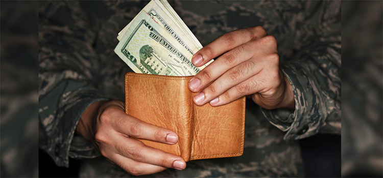 a man pulling money out of a wallet