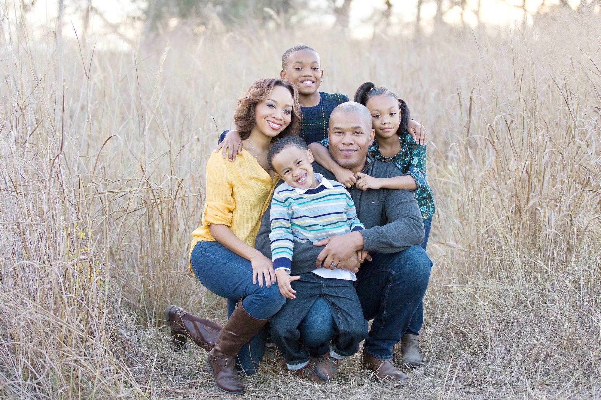 a picture of curtez riggs with his wife and kids