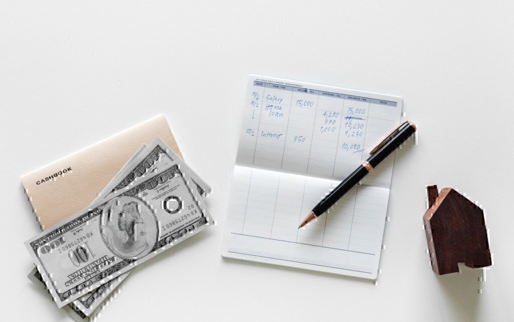 a picture of a check book and money