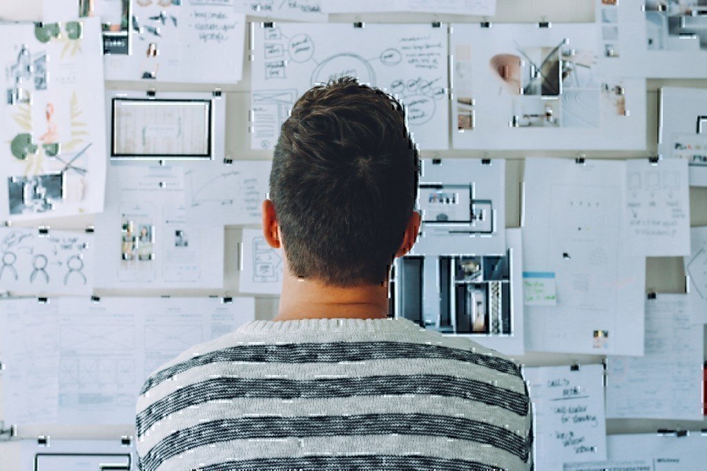 a man staring at a planning board