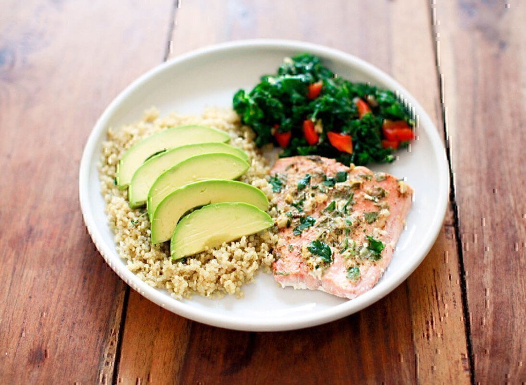 a picture of a fish dinner with avocado