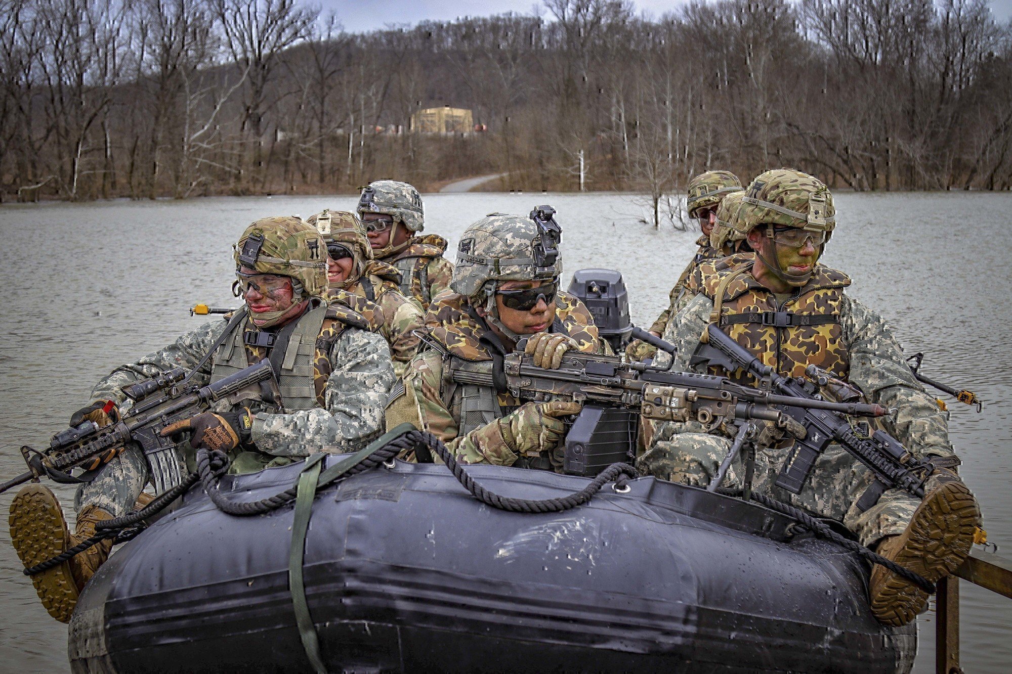 army soldiers moving in a boat