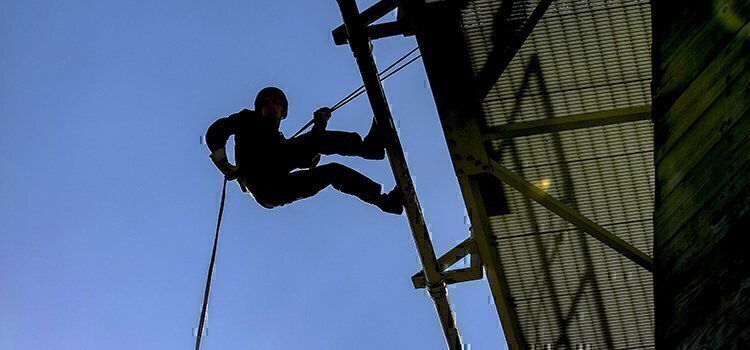 a picture of someone rappelling
