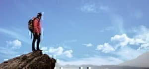 someone on top of a mountain