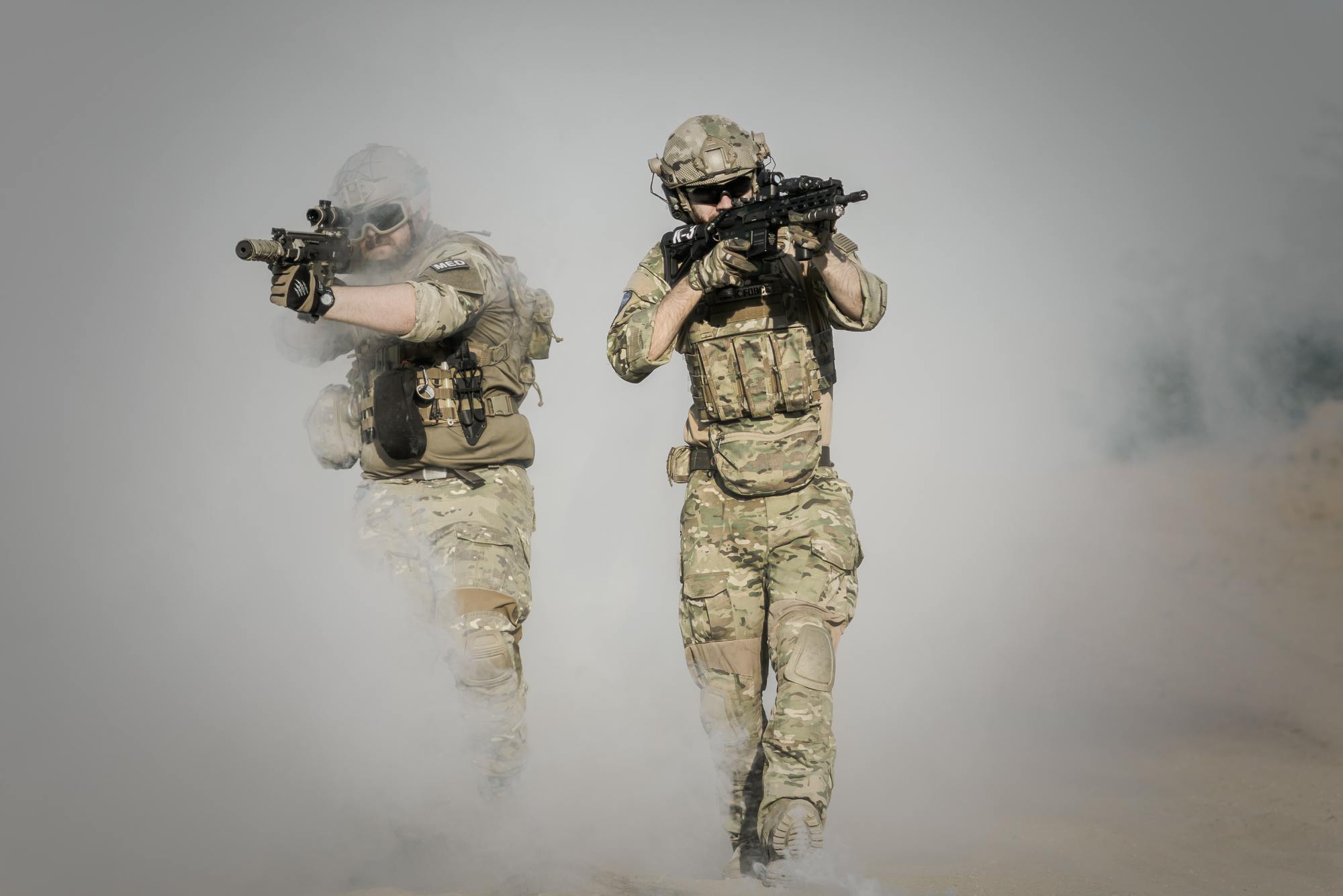 two guys doing action in army uniforms
