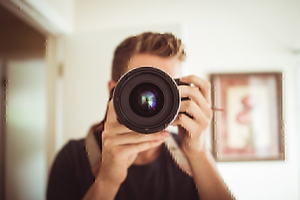 a man holding a camera