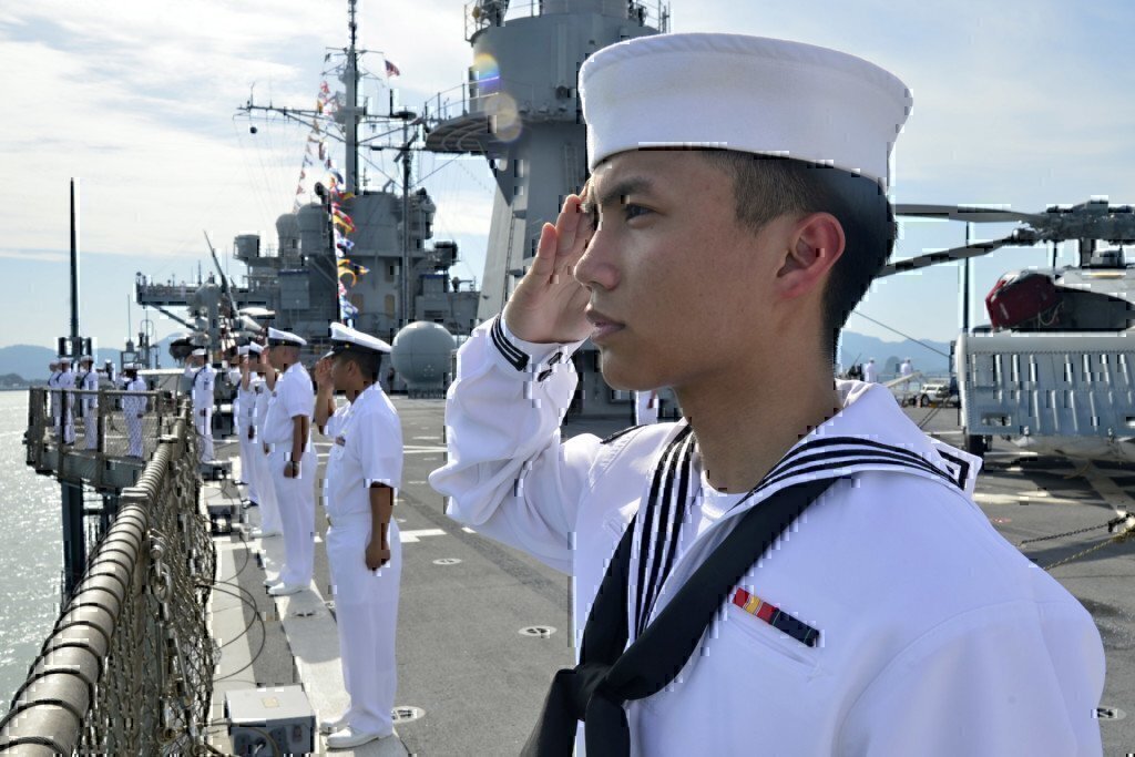 sailors in the navy saluting