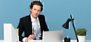 a man on a laptop looking professional