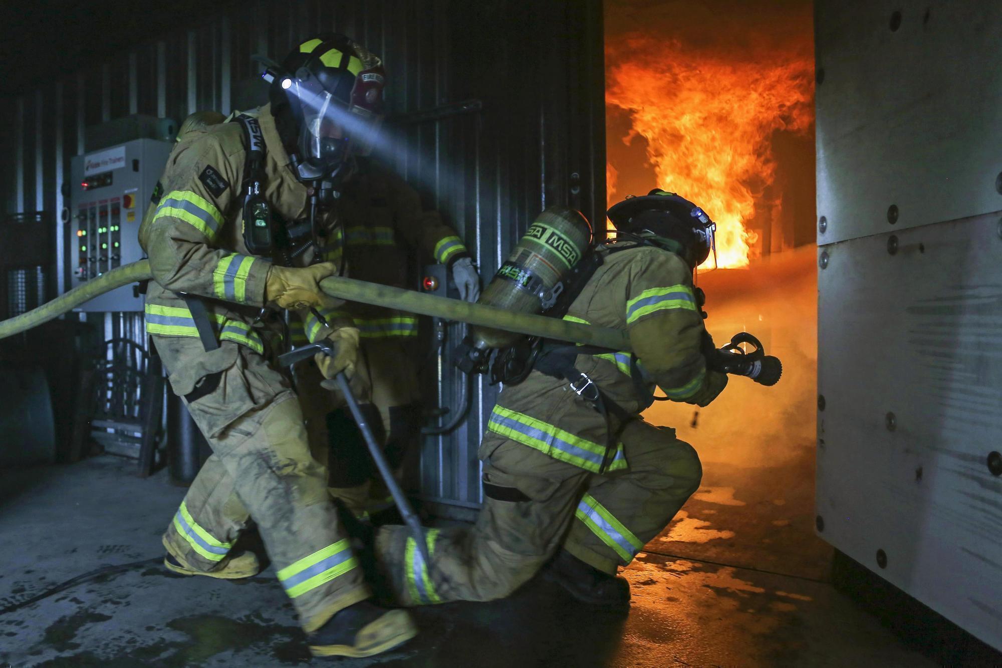firefighters working and training