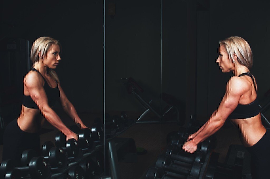 girl lifting dumbbell weights