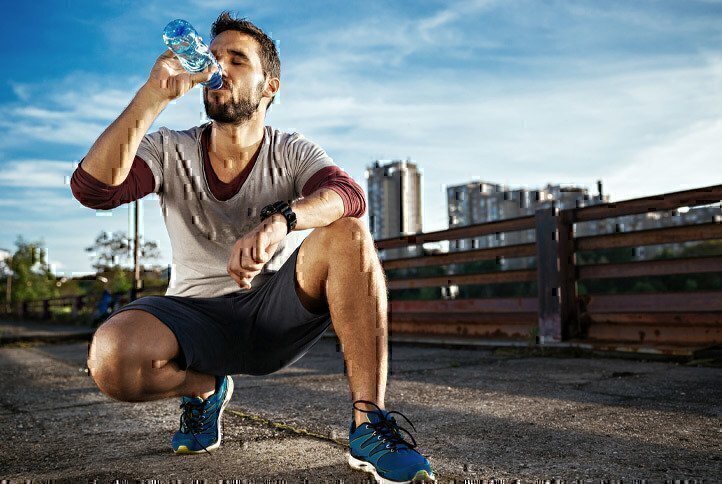 man-drinking-water-after-workout