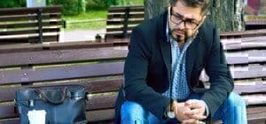 man-sitting-bench-frustrated-job-search