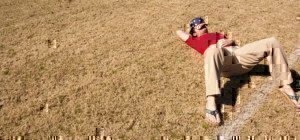 man-sleeping-in-field