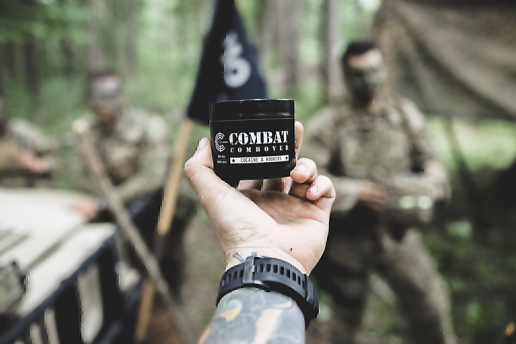 a soldier holding a jar of pomade