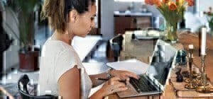 female-student-working-on-laptop