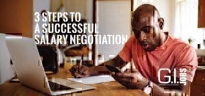 man-with-phone-and-laptop-writing-on-paper