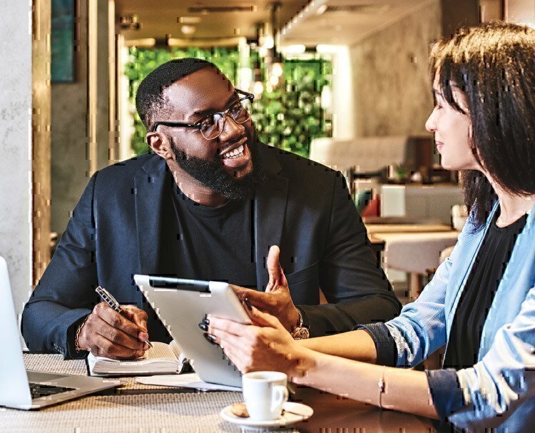 african-american-man-taking-notes-during-interview