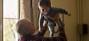 grandfather-holding-his-grandchild
