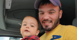 Sam Rojas, Navy Veteran, proudly showing His son his job as a truck driver