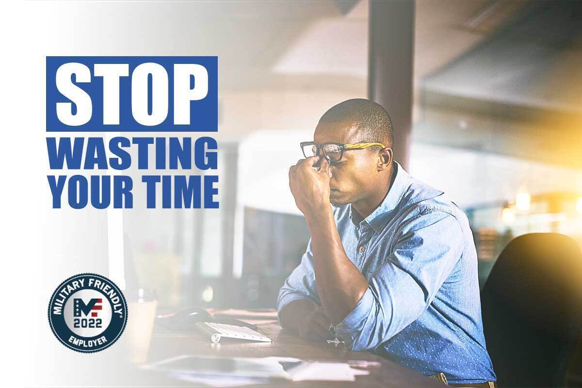 A black man sits at the computer exhausted from looking for companies hiring veterans. Stop Wasting Your Time. The military friendly employer list guides you to companies that prioritize veteran hiring.