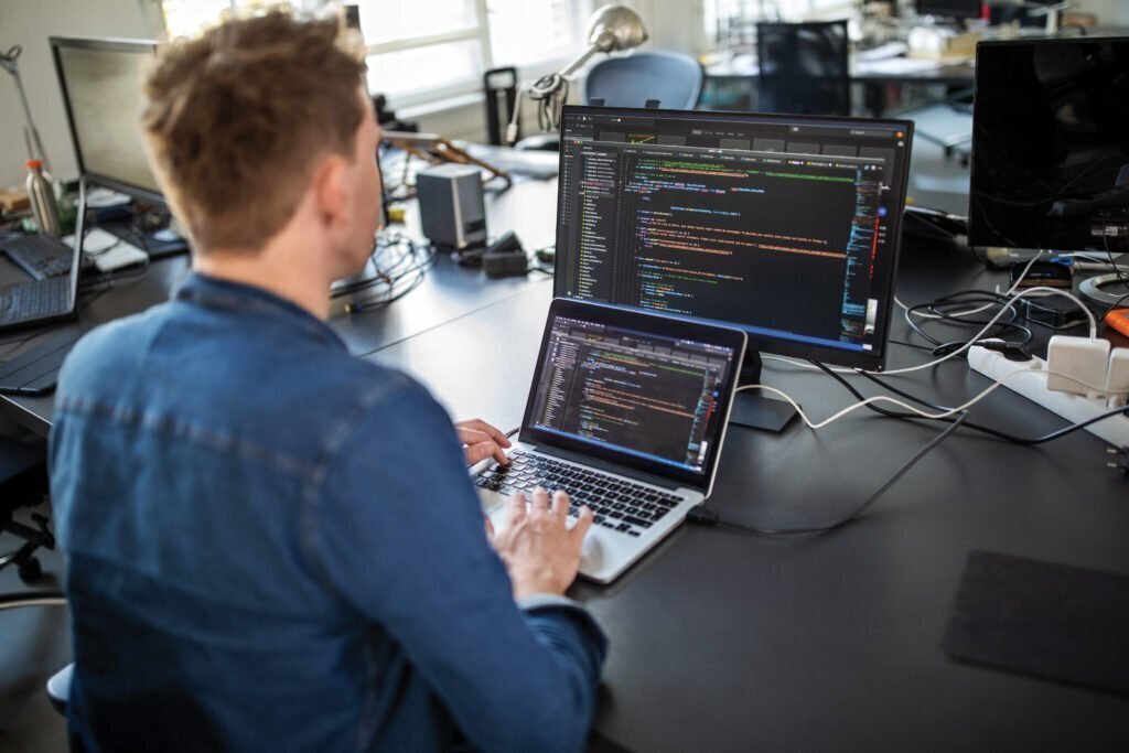 A veteran at work coding. Jobs in tech are an example of one of the top jobs for veterans in 2022