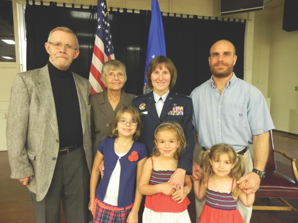 LaBue in her Air Force uniform with her family before her military transition.