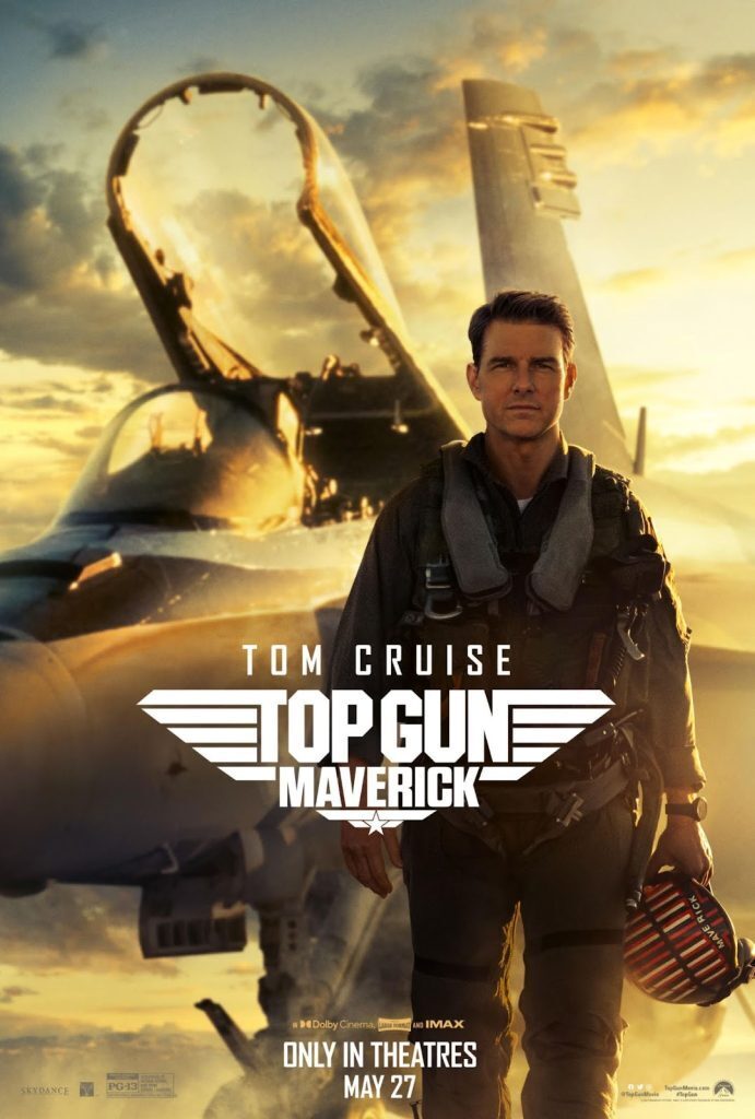 Tom Cruise with a tomcat plane behind him on the movie poster for Top Gun