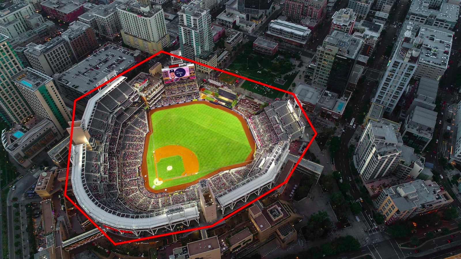 an aerial view of a baseball stadium with an example of the geo-fenced radius for an advertising campaign