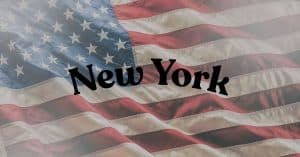 American flag with the words New York written across the stripes in bold letters.