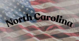 "North Carolina" over a waving American flag background (patriotic banner style).